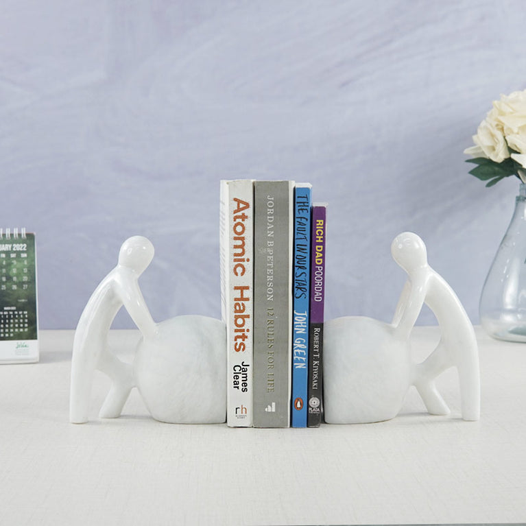 Man Pushing Stone Bookends - set of 2